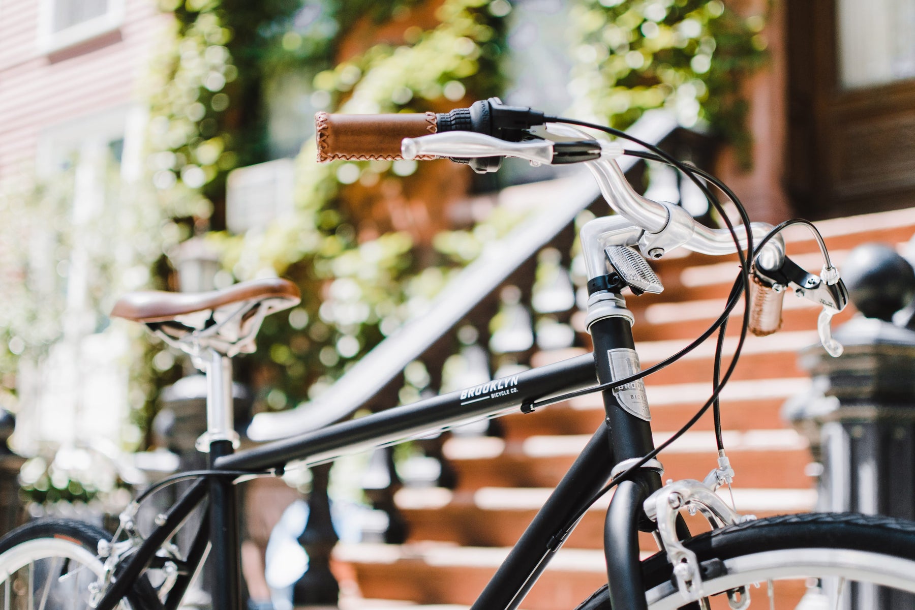 Matte Black Bedford commuter bicycle in front of brownstone steps
