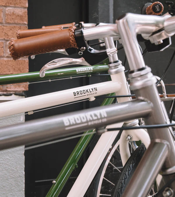 Three Bedford bicycles in a row - Raw silver, Ivory, and Army Green